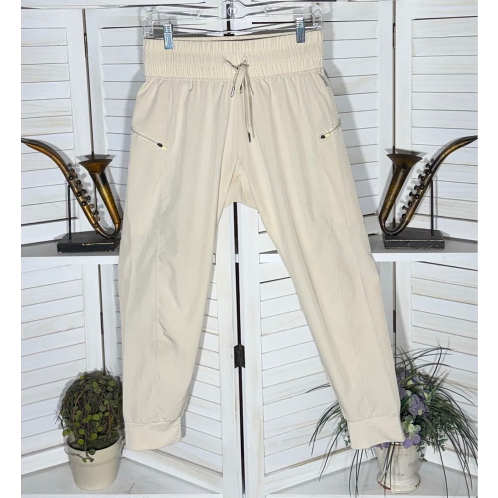 light beige jogger elastic waist zip pockets lightweight activewear yoga running